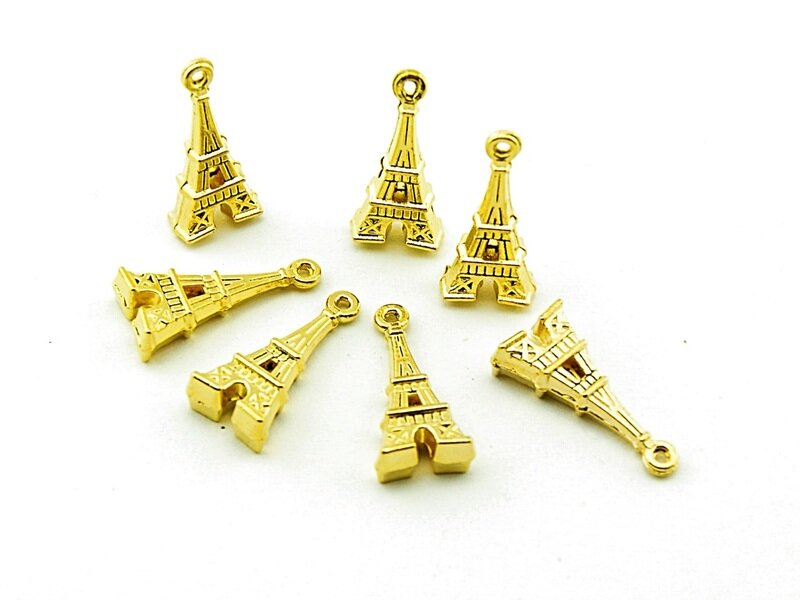 8 goldfarbene Eiffeltürme