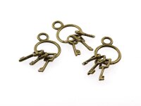 3 filigrane Schlüsselringe in vintage Bronze